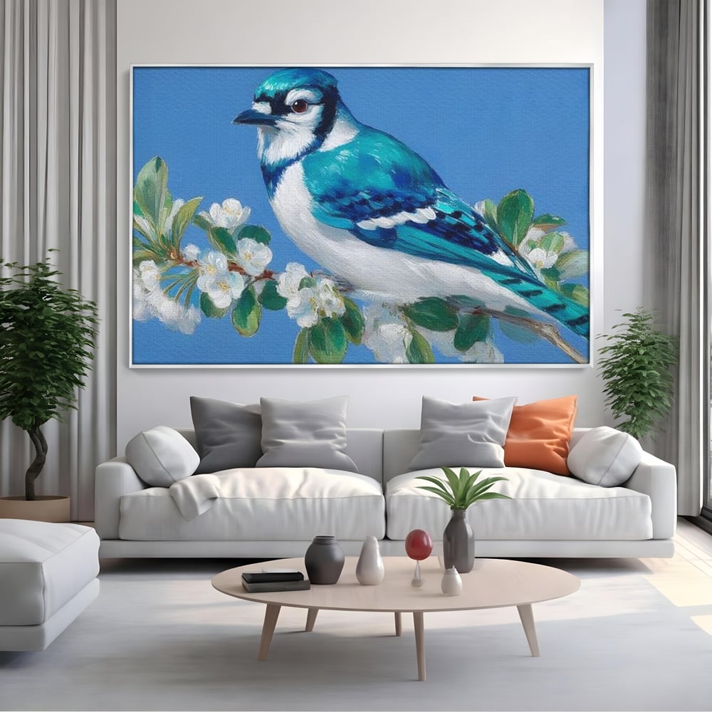 Tablou canvas cu tablou canvas cu gai albastra pe ramura, in rama de aluminiu argintiu, pe perete intr-un living